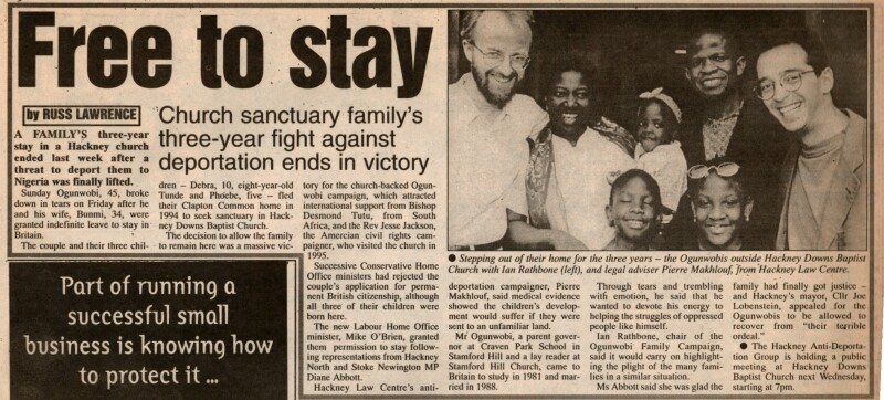 A photo of a newspaper article with the headline "Free to stay"